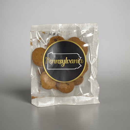 Packaged chocolate chip cookies with a Pennsylvania label on a gray background